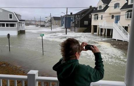Sue Parmer took photos of the rising surf on Oceanside Drive in Scituate at high tide on Saturday.
